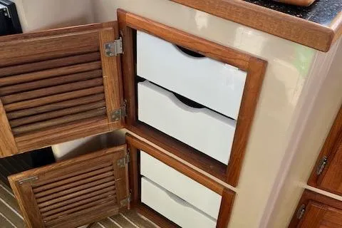 Mystic Yacht Photos Pics 2014 Ranger Tugs R-31 interior with wooden cabinets and white drawers.