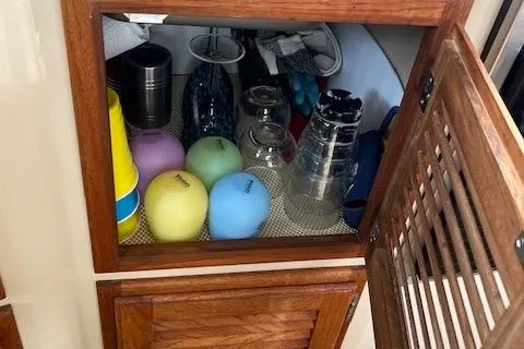 Mystic Yacht Photos Pics Cabinet interior on 2014 Ranger Tugs R-31 with colorful cups and glasses.