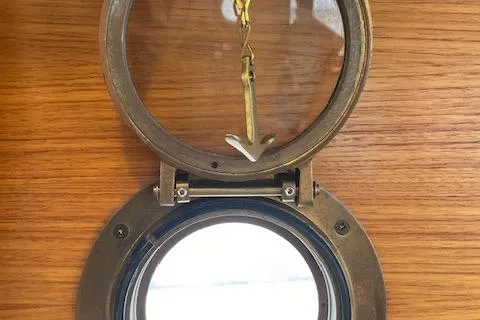 Mystic Yacht Photos Pics Porthole window on 2014 Ranger Tugs R-31 boat with wooden interior.