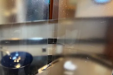 Mystic Yacht Photos Pics Close-up of a 2014 Ranger Tugs R-31 interior, featuring reflective surfaces and blurred background.