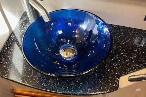 Mystic Yacht Photos Pics Blue glass sink on speckled countertop in 2014 Ranger Tugs R-31 boat.