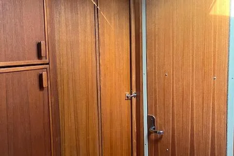 Mystic Yacht Photos Pics 2014 Ranger Tugs R-31 interior with wooden cabinetry and door.