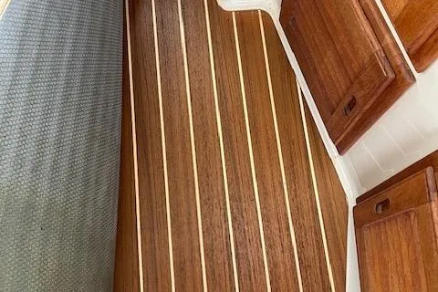 Mystic Yacht Photos Pics Teak flooring and wooden cabinetry inside 2014 Ranger Tugs R-31 boat.