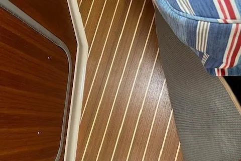 Mystic Yacht Photos Pics Interior view of 2014 Ranger Tugs R-31 with wood flooring and striped upholstery.