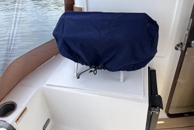 Mystic Yacht Photos Pics Covered equipment on 2014 Ranger Tugs R-31 boat deck near water.