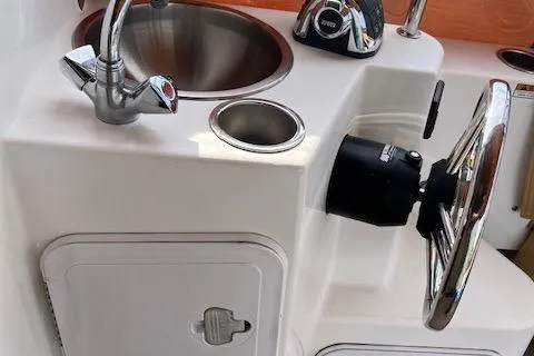 Mystic Yacht Photos Pics 2014 Ranger Tugs R-31 helm with steering wheel, sink, and faucet.