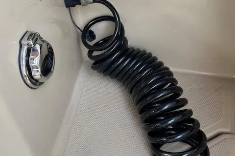 Mystic Yacht Photos Pics Coiled black hose in 2014 Ranger Tugs R-31 boat interior.