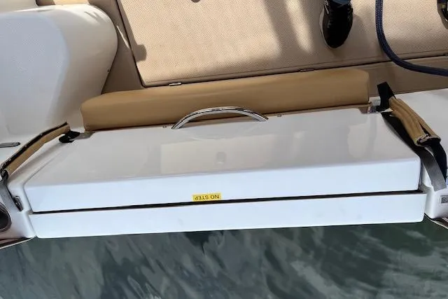 Mystic Yacht Photos Pics 2014 Ranger Tugs R-31 boat deck with cushioned seating and storage compartment.