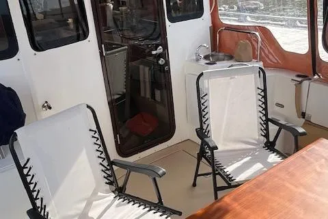 Mystic Yacht Photos Pics 2014 Ranger Tugs R-31 interior with chairs and table on deck.