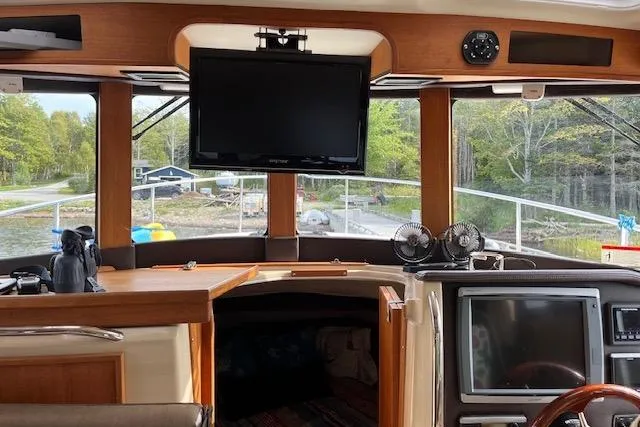 Mystic Yacht Photos Pics Interior view of 2014 Ranger Tugs R-31 boat with navigation equipment and scenic window view.