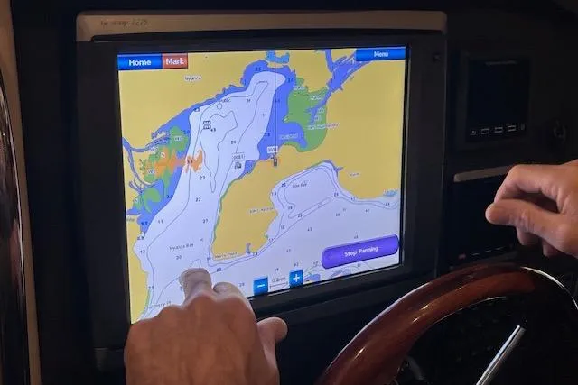 Mystic Yacht Photos Pics Touchscreen navigation system on 2014 Ranger Tugs R-31 boat, displaying nautical map.