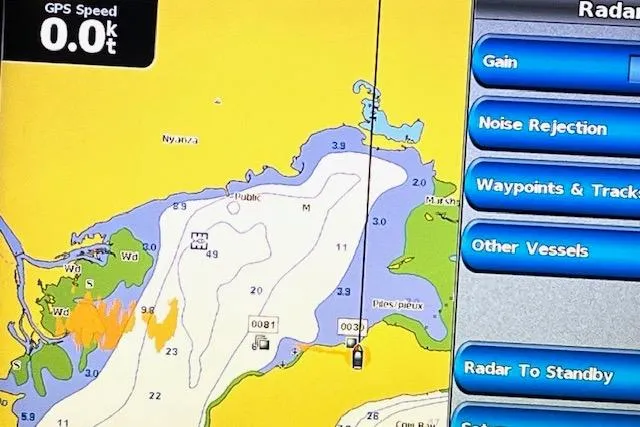 Mystic Yacht Photos Pics Boat navigation screen displaying GPS map and radar settings on a 2014 Ranger Tugs R-31.