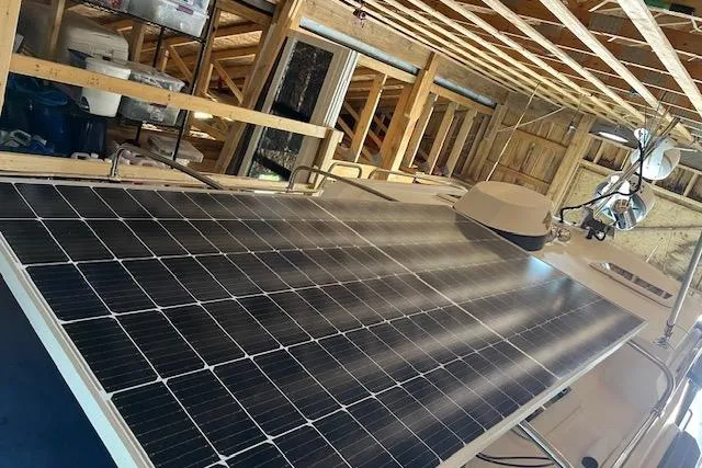 Mystic Yacht Photos Pics Solar panels on 2014 Ranger Tugs R-31 boat in wooden structure.