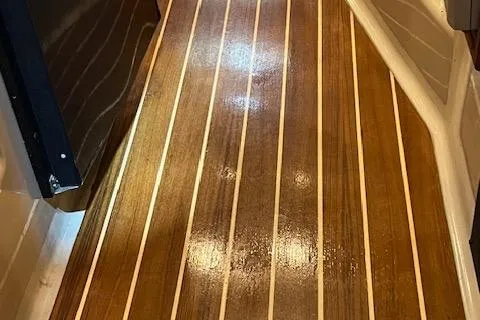 Mystic Yacht Photos Pics Teak flooring on 2014 Ranger Tugs R-31 boat, showcasing polished wood finish.