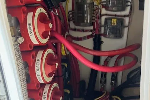 Mystic Yacht Photos Pics Electrical panel with red cables in a 2014 Ranger Tugs R-31 boat.