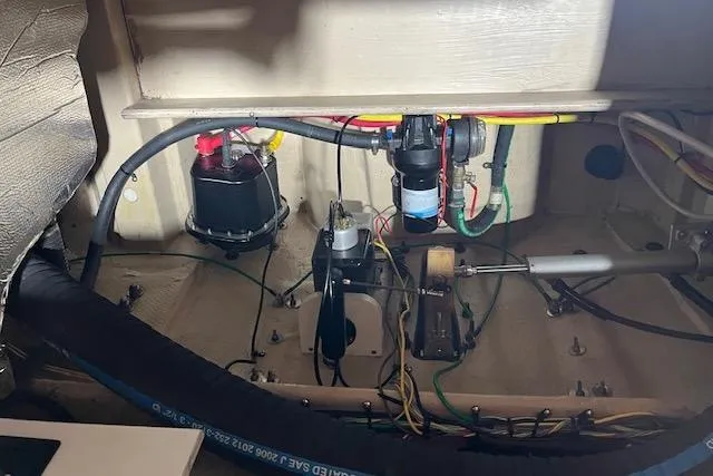 Mystic Yacht Photos Pics 2014 Ranger Tugs R-31 engine compartment with wiring and mechanical components.