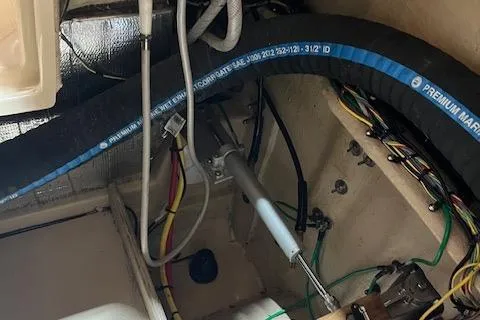 Mystic Yacht Photos Pics Engine compartment of 2014 Ranger Tugs R-31 with marine hoses and wiring.