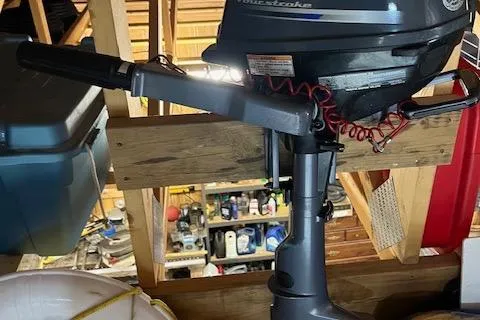 Mystic Yacht Photos Pics Outboard motor in storage, surrounded by various garage items, Ranger Tugs R-31, 2014 model.