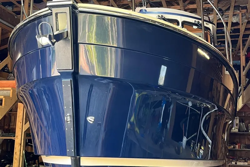 Mystic Yacht Photos Pics 2014 Ranger Tugs R-31 boat in storage, showcasing sleek blue hull design.