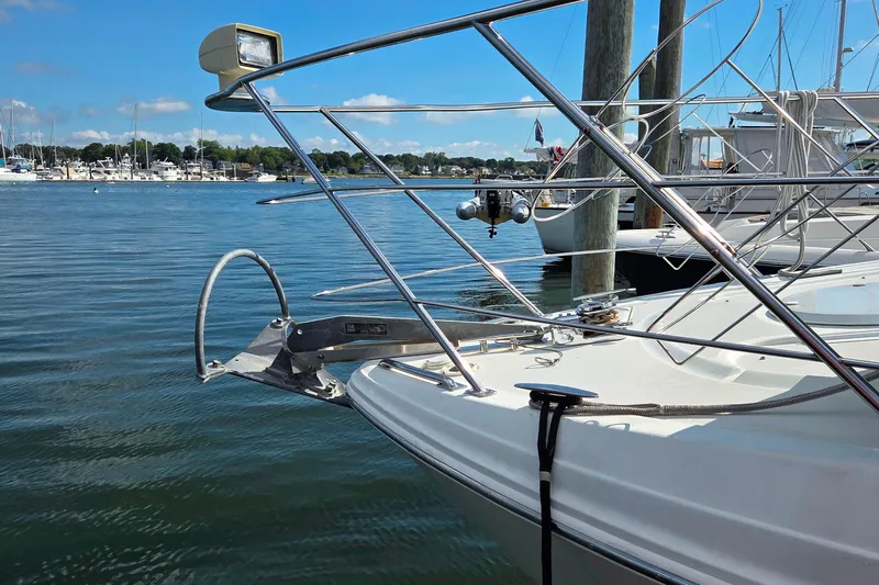 All In Yacht Photos Pics 2004 Carver 444 Cockpit Motor Yacht docked in a marina, featuring sleek railings and clear blue water.