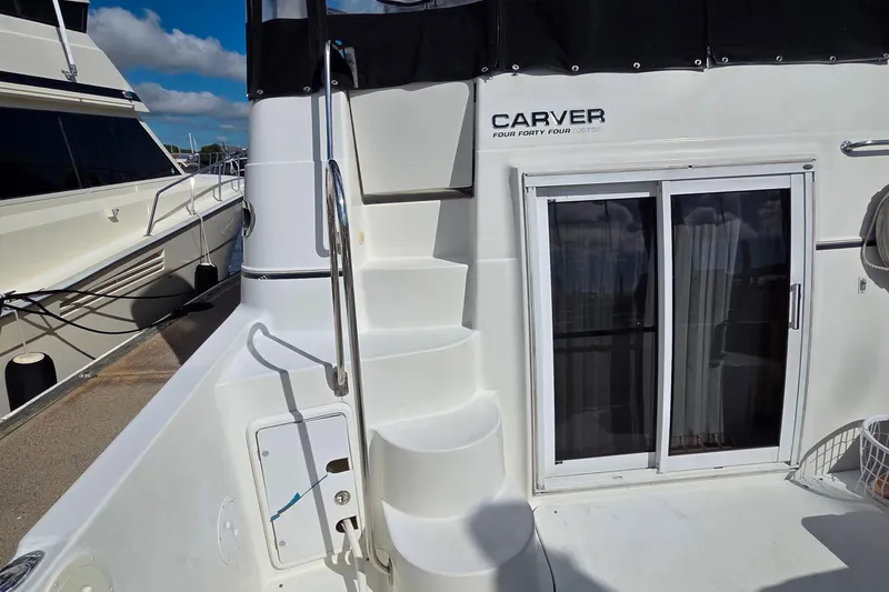 All In Yacht Photos Pics 2004 Carver 444 Cockpit Motor Yacht with stairs and sliding glass door.