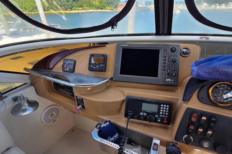 All In Yacht Photos Pics Cockpit of 2004 Carver 444 Cockpit Motor Yacht with navigation equipment and controls.