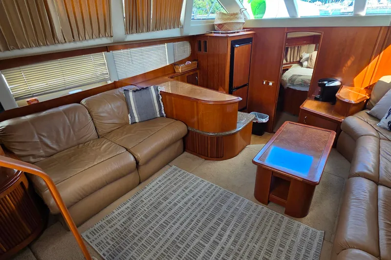 All In Yacht Photos Pics Luxurious interior of 2004 Carver 444 Cockpit Motor Yacht with leather seating and wood finishes.