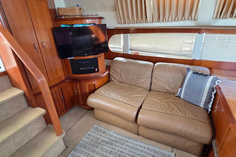 All In Yacht Photos Pics Luxurious interior of 2004 Carver 444 Cockpit Motor Yacht with leather sofa and TV.