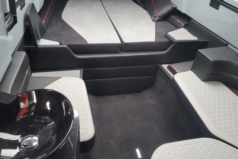  Yacht Photos Pics Luxurious interior of 2022 Axopar Brabus Shadow 900 ST with modern seating and sleek design.