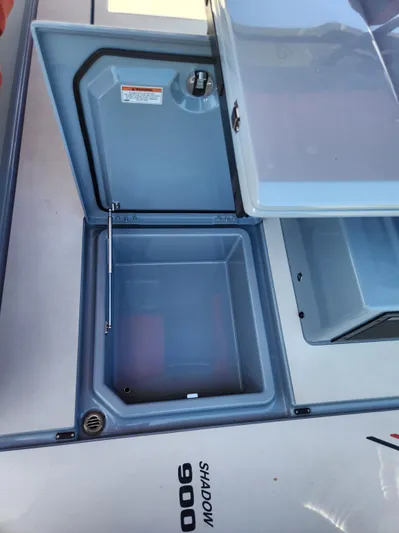  Yacht Photos Pics 2022 Axopar Brabus Shadow 900 ST storage compartment with open lid.