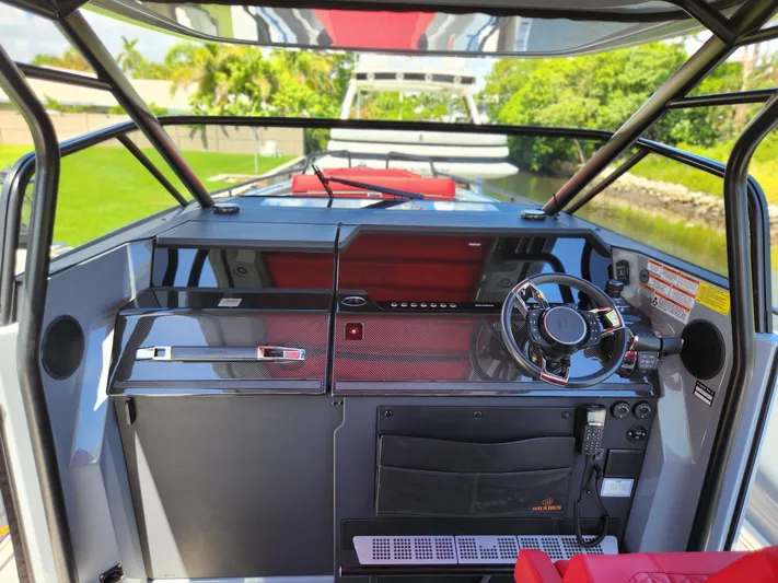  Yacht Photos Pics 2022 Axopar Brabus Shadow 900 ST cockpit with sleek design and modern controls.