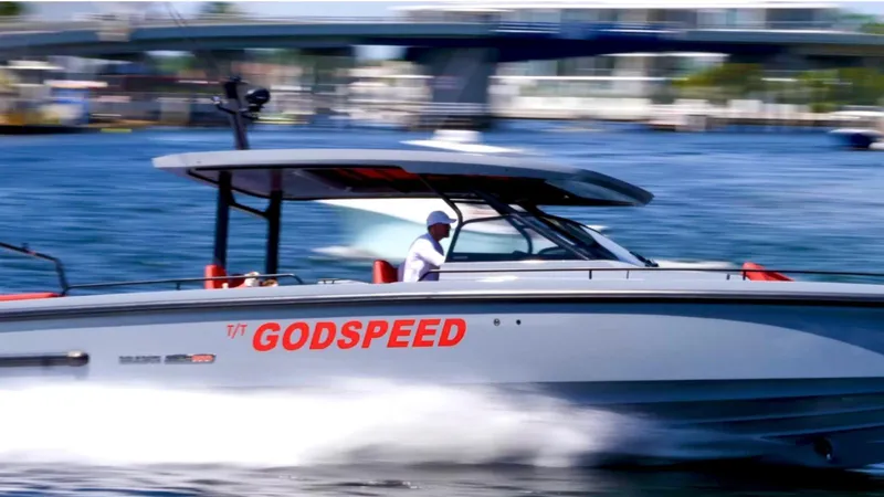  Yacht Photos Pics 2022 Axopar Brabus Shadow 900 ST speeding on water, labeled "GODSPEED."