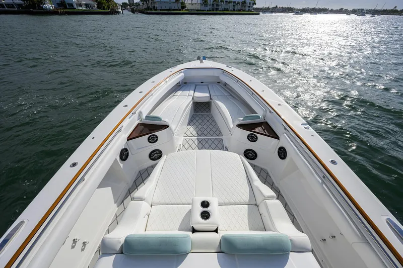  Yacht Photos Pics Luxurious 2021 HCB 53 Sueños boat interior with plush seating on calm water.