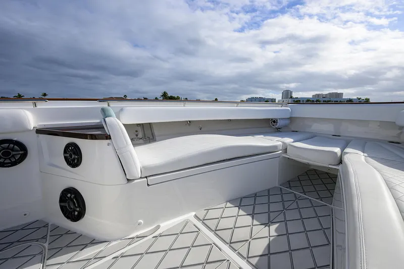  Yacht Photos Pics Luxurious seating area on 2021 HCB 53 Sueños boat under cloudy sky.
