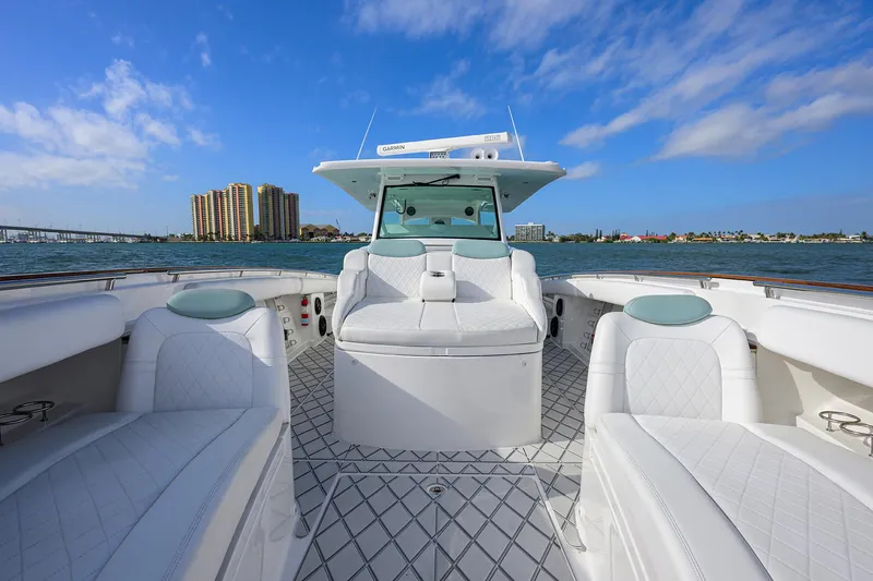  Yacht Photos Pics 2021 HCB 53 Sueños luxury boat interior with white seating and ocean view.