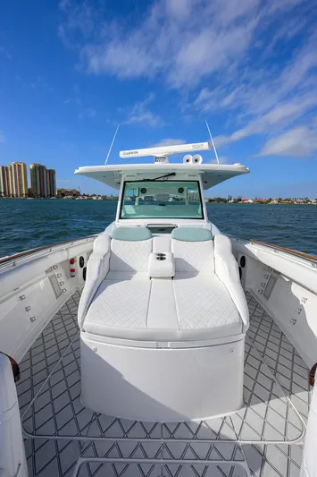  Yacht Photos Pics 2021 HCB 53 Sueños boat on water, clear sky, luxury deck view.