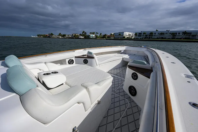  Yacht Photos Pics 2021 HCB 53 Sueños luxury boat interior with plush seating on a calm waterway.