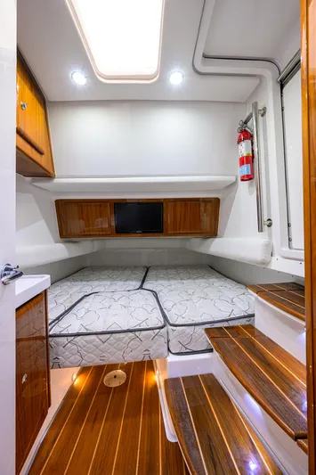  Yacht Photos Pics Luxurious cabin interior of 2021 HCB 53 Sueños with wood accents and modern amenities.