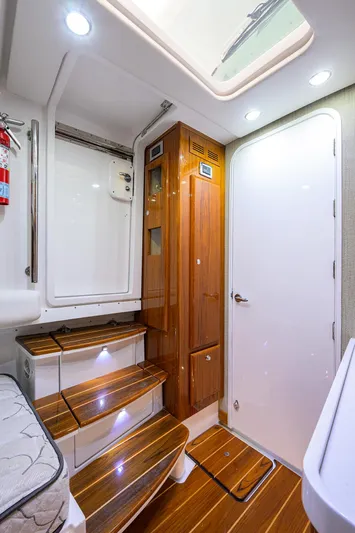  Yacht Photos Pics Interior of 2021 HCB 53 Sueños boat with wooden stairs and modern design.