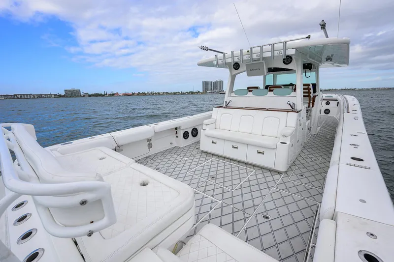  Yacht Photos Pics 2021 HCB 53 Sueños boat with spacious deck and luxurious seating on open water.