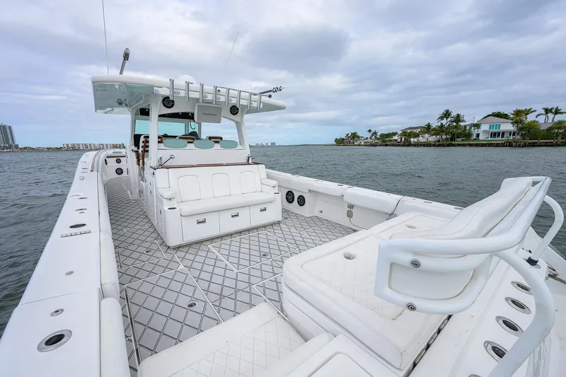  Yacht Photos Pics Luxurious 2021 HCB 53 Sueños boat with spacious deck and seating on calm waters.