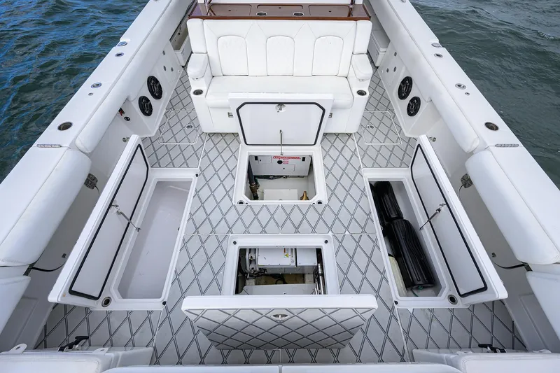  Yacht Photos Pics Spacious deck of 2021 HCB 53 Sueños boat with storage compartments open.