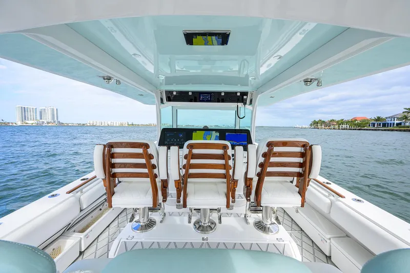  Yacht Photos Pics 2021 HCB 53 Sueños boat interior with helm seats and ocean view.