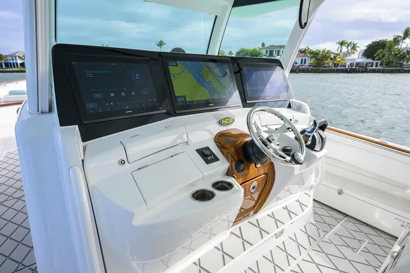  Yacht Photos Pics 2021 HCB 53 Sueños boat helm with advanced navigation screens and sleek steering wheel.