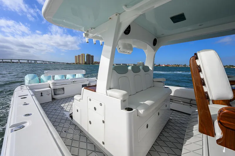  Yacht Photos Pics 2021 HCB 53 Sueños luxury boat interior on open water, featuring white seating and modern design.