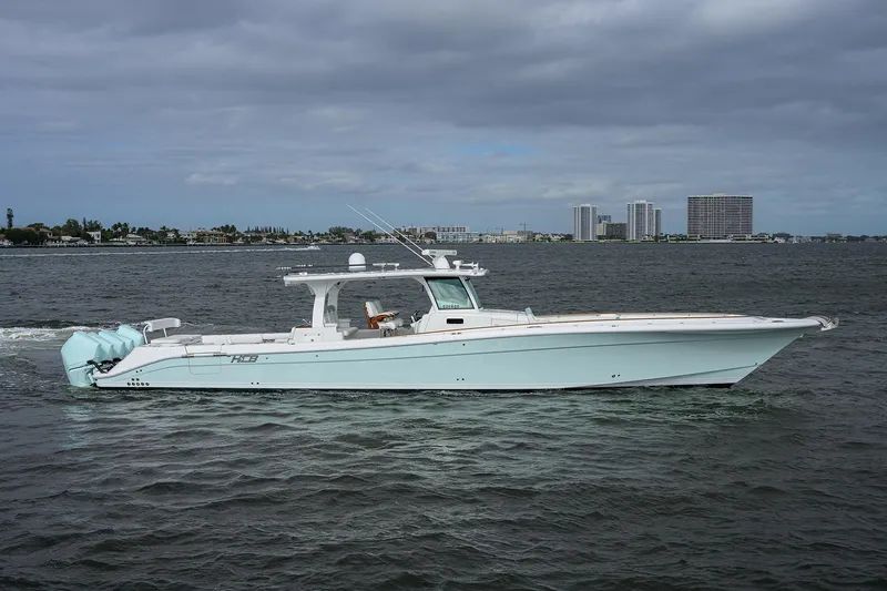  Yacht Photos Pics 2021 HCB 53 Sueños boat cruising on a calm, cloudy day.