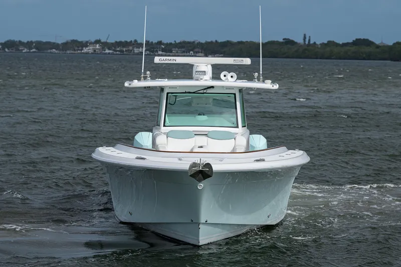  Yacht Photos Pics Front view of 2021 HCB 53 Sueños boat on water.