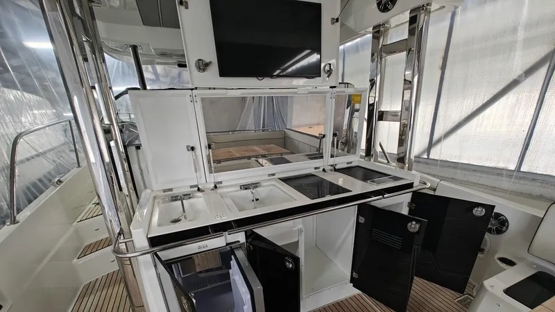  Yacht Photos Pics Interior view of 2021 Jeanneau CAP CAMARAT 12.5WA boat with modern amenities and sleek design.