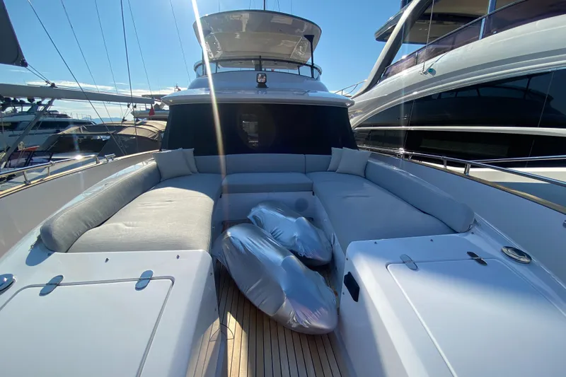  Yacht Photos Pics 2025 Azimut Magellano 66 yacht with spacious deck and seating area.