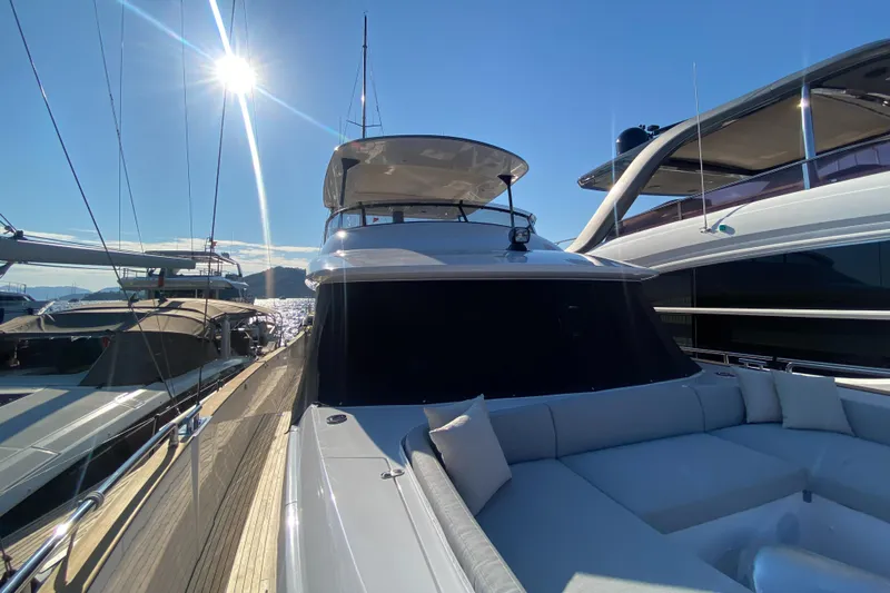  Yacht Photos Pics 2025 Azimut Magellano 66 yacht docked under bright sun, showcasing sleek design.